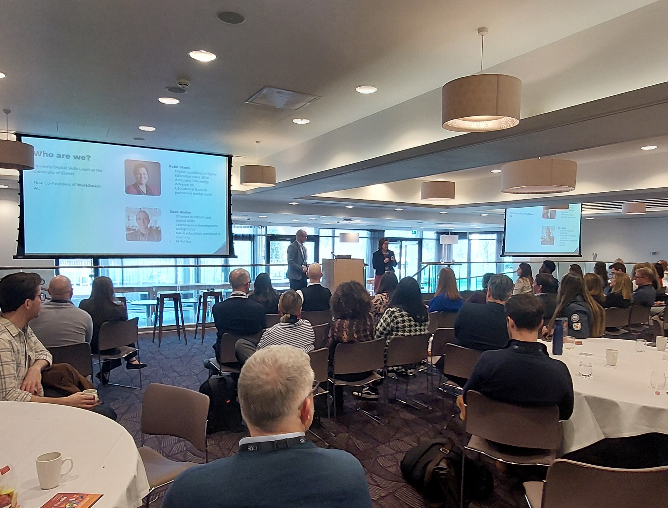WorkSmart-AI co-founders presenting at a conference to an audience